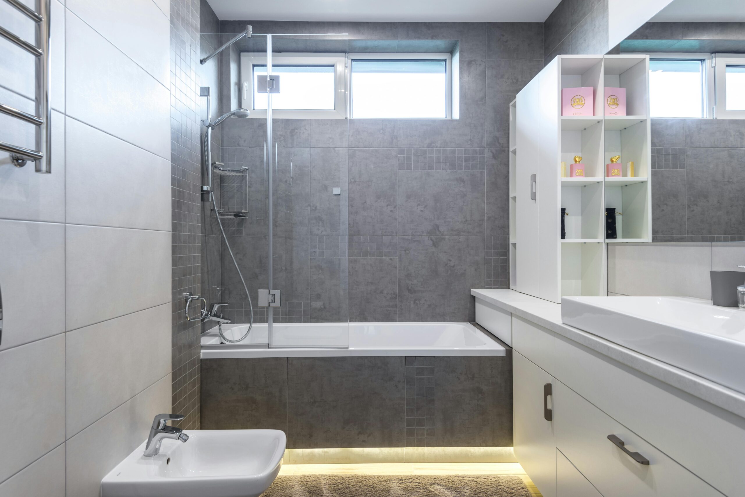 large custom shower and bathtub with gray tile